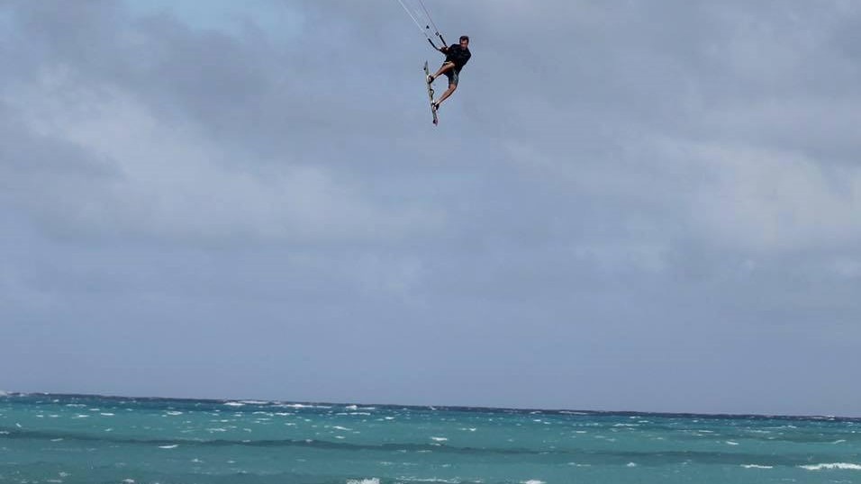 Bill Kraft throwing a massive jump on his kite and surfboard
