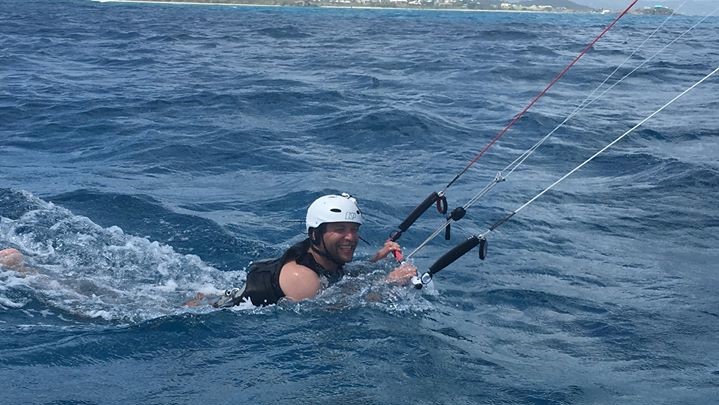 kitesurfing student is learning to body drag on the island of St. Croix